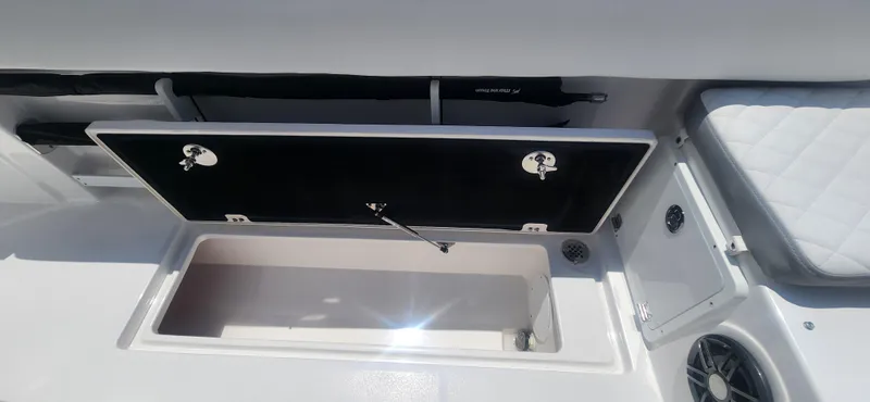 Slide: The Image of Open storage compartment on a 2025 Sea Fox 268 Commander boat. - 14