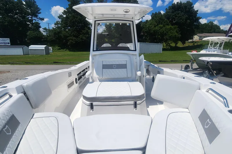 Slide: The Image of 2025 Sea Fox 268 Commander boat interior with white seating and console. - 4