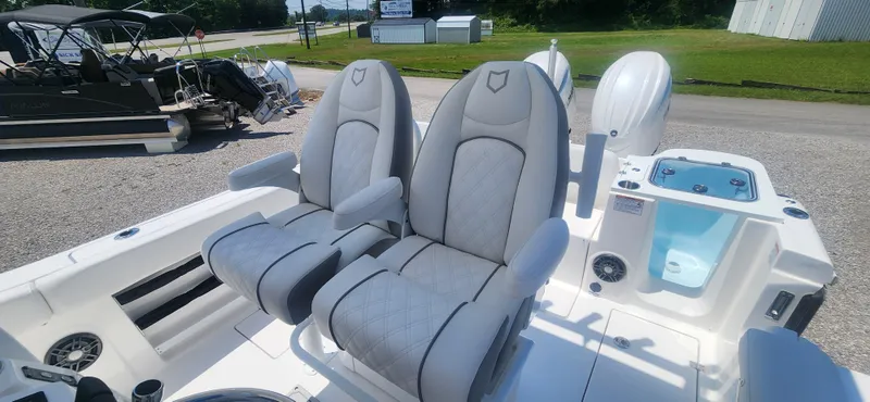 Slide: The Image of 2025 Sea Fox 268 Commander boat with dual captain's chairs and modern amenities. - 6