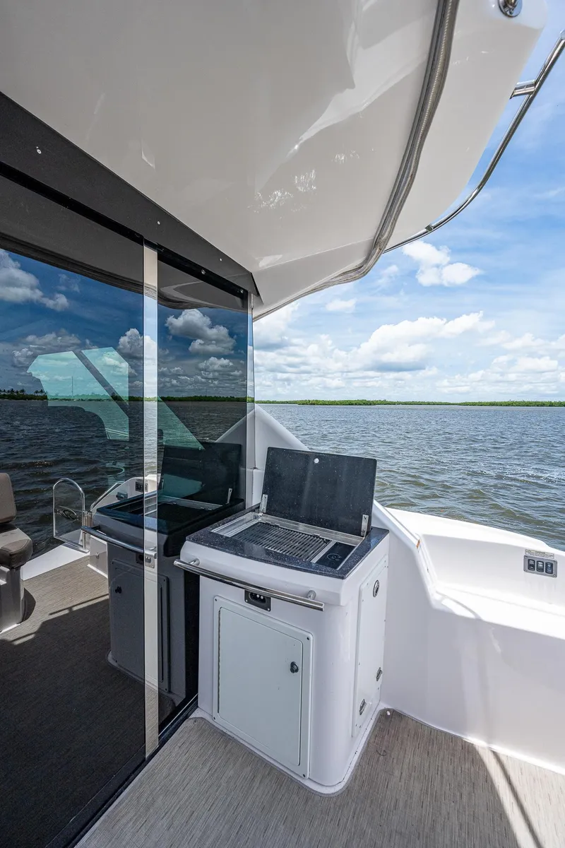 Slide: The Image of 2015 Regal 46 Sport Coupe boat interior with water view. - 27