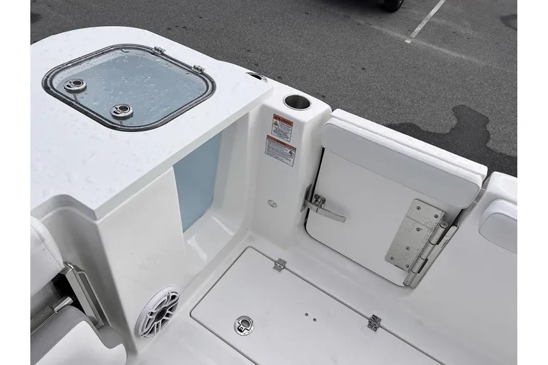 Slide: The Image of 2025 Sea Fox 288 Commander boat deck with storage compartments and seating. - 10