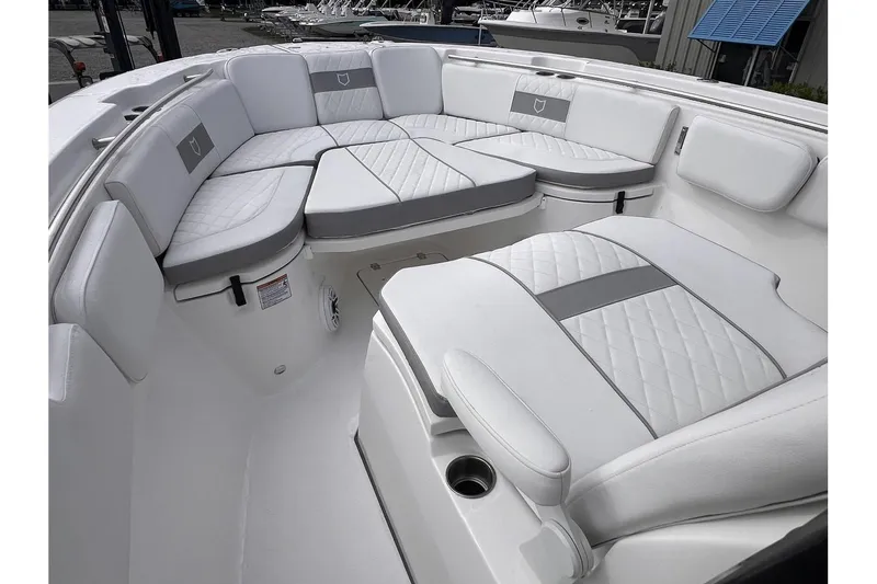 Slide: The Image of 2025 Sea Fox 288 Commander boat with luxurious white seating area. - 16