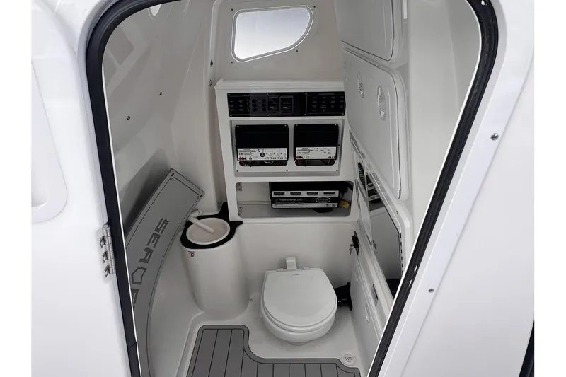 Slide: The Image of Interior of 2025 Sea Fox 288 Commander boat with toilet and control panels. - 17