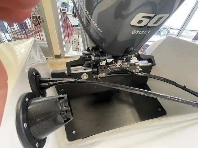 Slide: The Image of 2024 Northstar Axis 4.2 boat with Yamaha 60 outboard motor, close-up view. - 7
