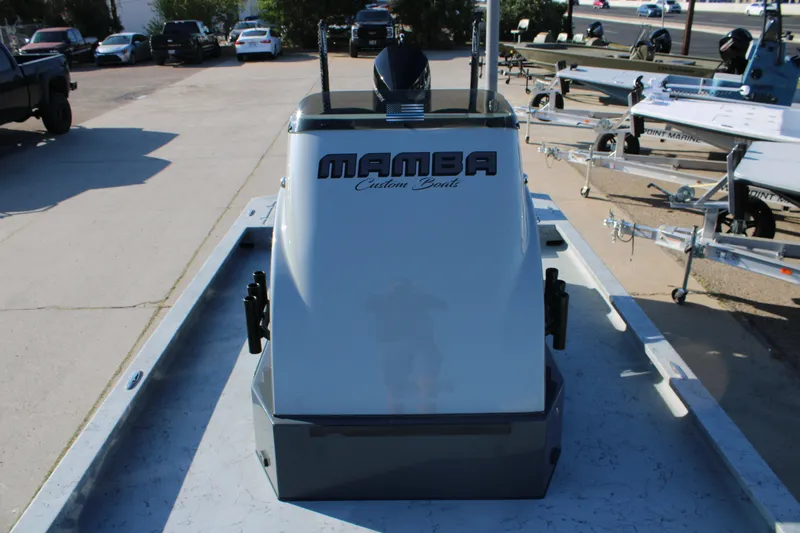 Slide: The Image of 2025 Mamba 23 Cat Classic boat on trailer, outdoor dealership setting. - 10