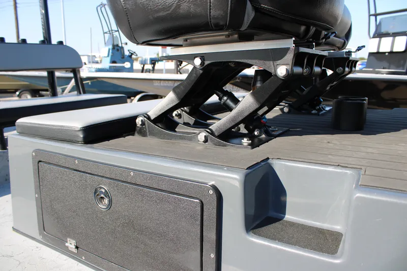 Slide: The Image of Adjustable seat mechanism on a 2025 Mamba 23 Cat Classic boat deck. - 19