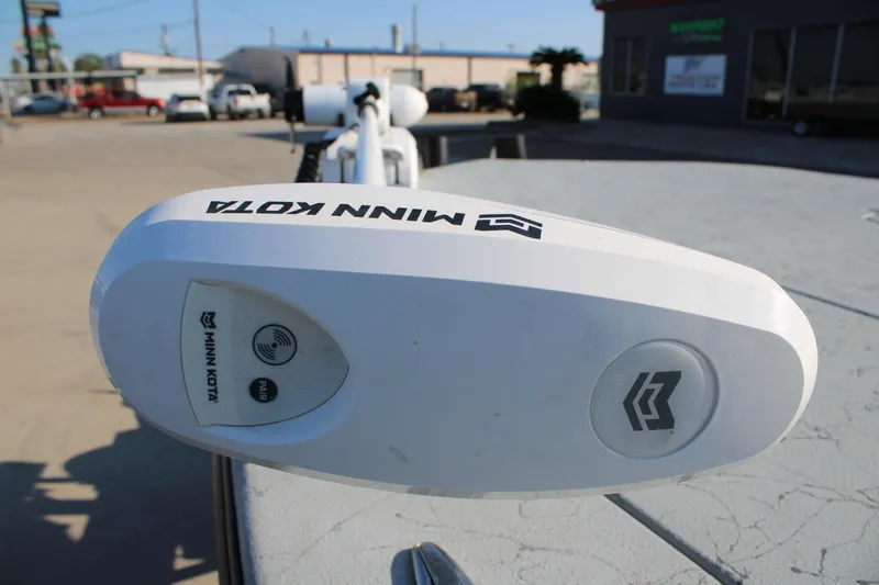 Slide: The Image of Minn Kota trolling motor on Mamba 23 Cat Classic, 2025 model, in a parking lot. - 21