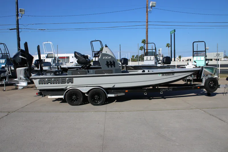 Slide: The Image of 2025 Mamba 23 Cat Classic boat on trailer in outdoor dealership lot. - 4