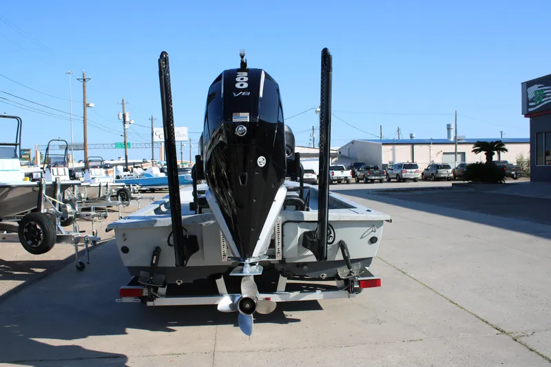 Slide: The Image of 2025 Mamba 23 Cat Classic boat with powerful V8 engine, parked outdoors. - 6