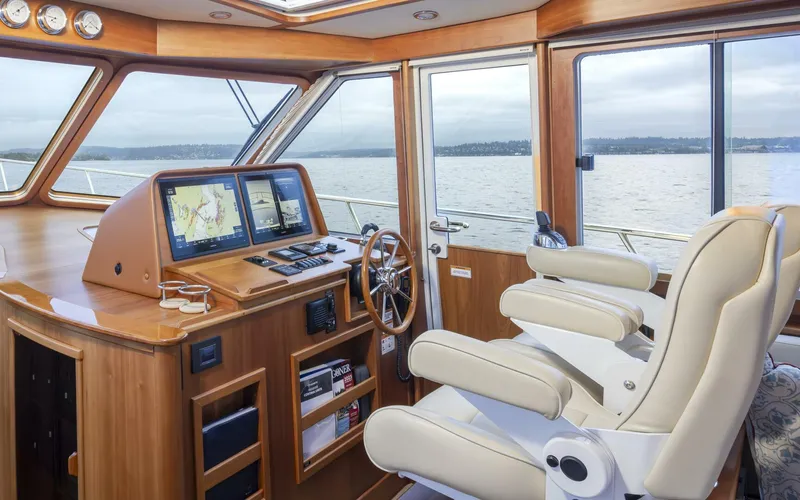 Slide: The Image of Interior of 2018 Sabre 45 Salon Express yacht with navigation equipment and luxurious seating. - 31