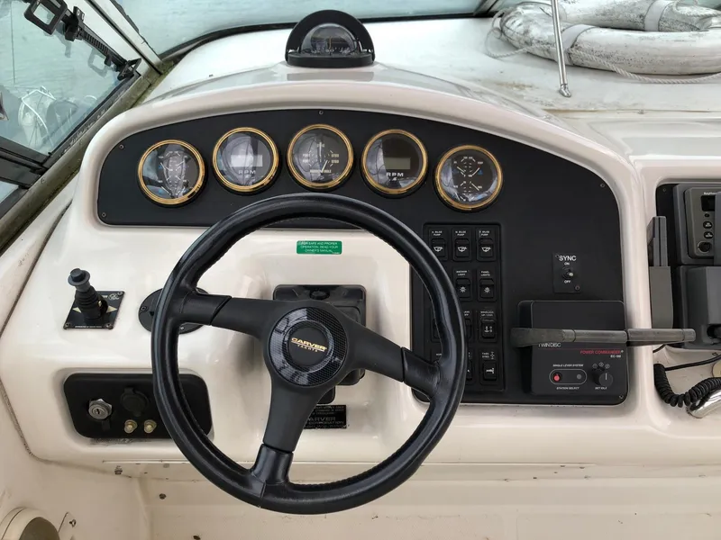 Slide: The Image of 1998 Carver 530 Voyager Pilothouse helm with steering wheel and instrument panel. - 17