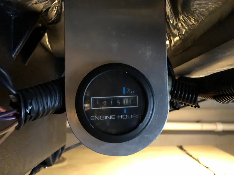 Slide: The Image of Engine hours meter on a 1998 Carver 530 Voyager Pilothouse showing 1015 hours. - 30