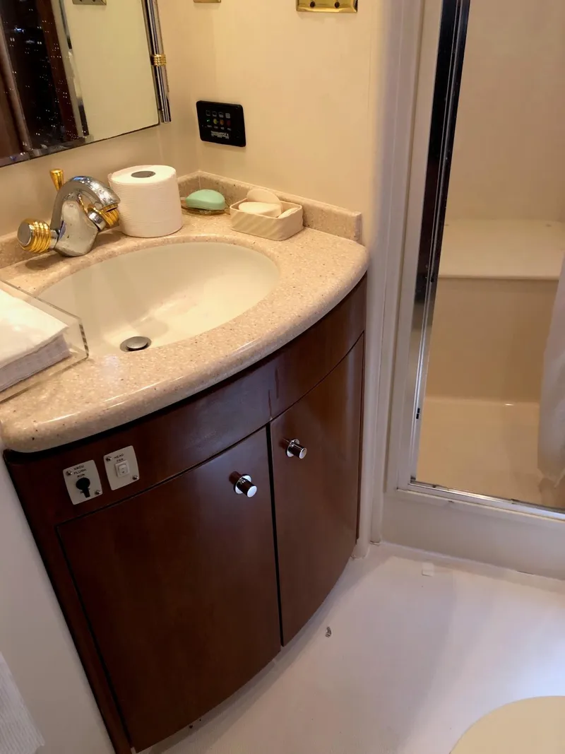 Slide: The Image of 1998 Carver 530 Voyager Pilothouse bathroom with sink and shower. - 44
