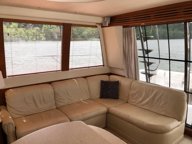 Slide: The Image of Luxurious interior of 1998 Carver 530 Voyager Pilothouse with leather seating and large windows. - 9
