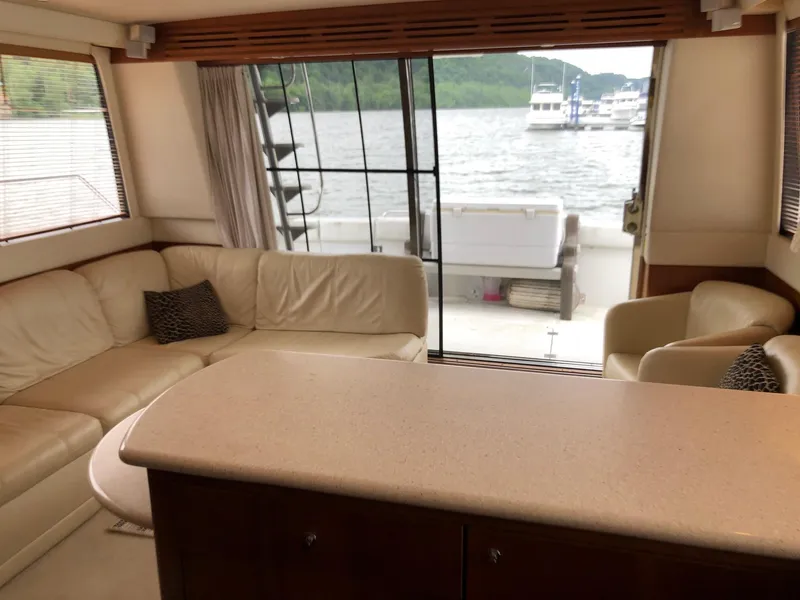 Slide: The Image of Interior of 1998 Carver 530 Voyager Pilothouse yacht with lake view. - 13