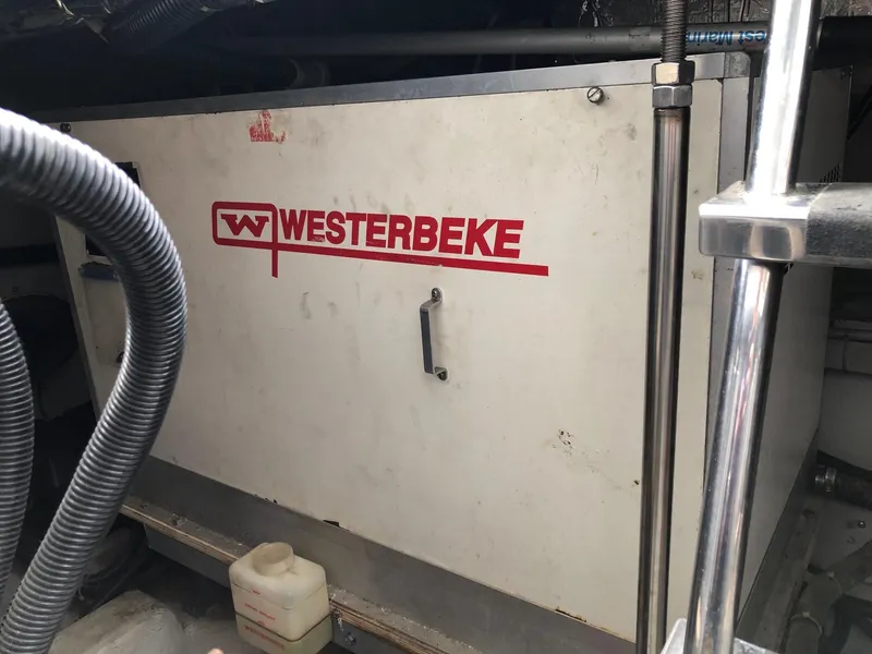 Slide: The Image of Westerbeke generator in 1998 Carver 530 Voyager Pilothouse engine room. - 21
