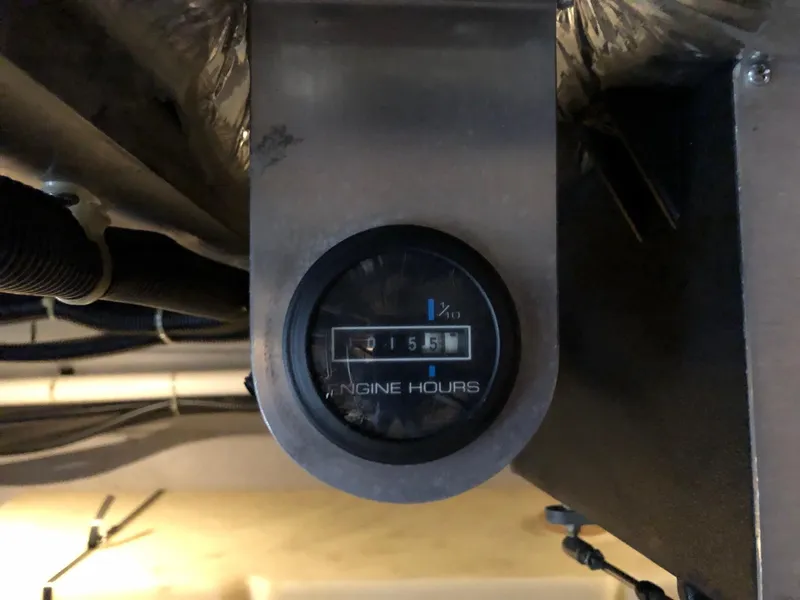 Slide: The Image of Engine hours gauge of a 1998 Carver 530 Voyager Pilothouse showing 155 hours. - 29