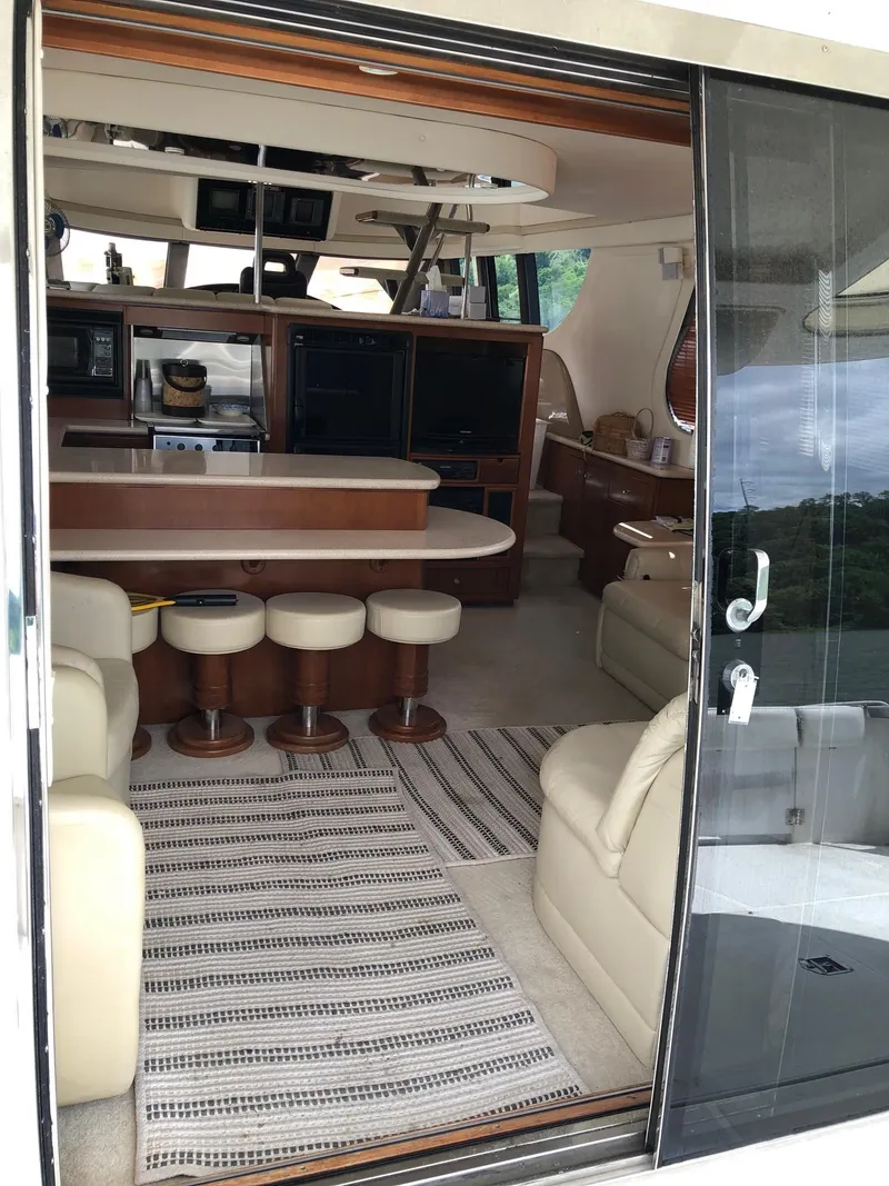 Slide: The Image of Interior of 1998 Carver 530 Voyager Pilothouse yacht with modern furnishings. - 6