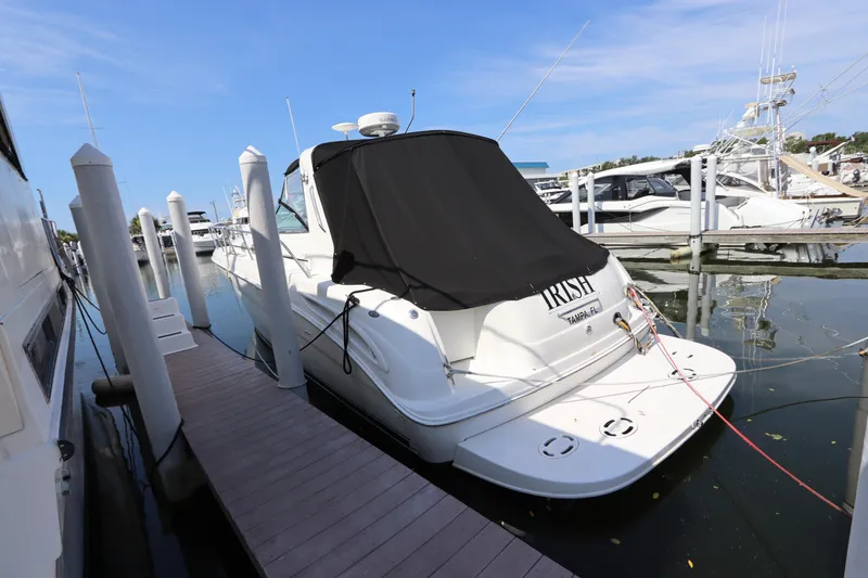 Slide: The Image of 1999 Sea Ray 380 Sundancer docked at marina. - 1