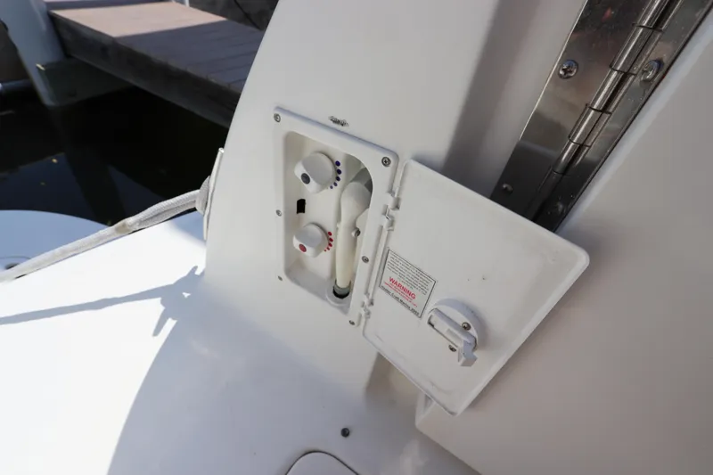 Slide: The Image of 1999 Sea Ray 380 Sundancer water hookup and electrical panel. - 11