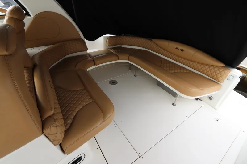 Slide: The Image of 1999 Sea Ray 380 Sundancer interior with tan leather seating. - 12