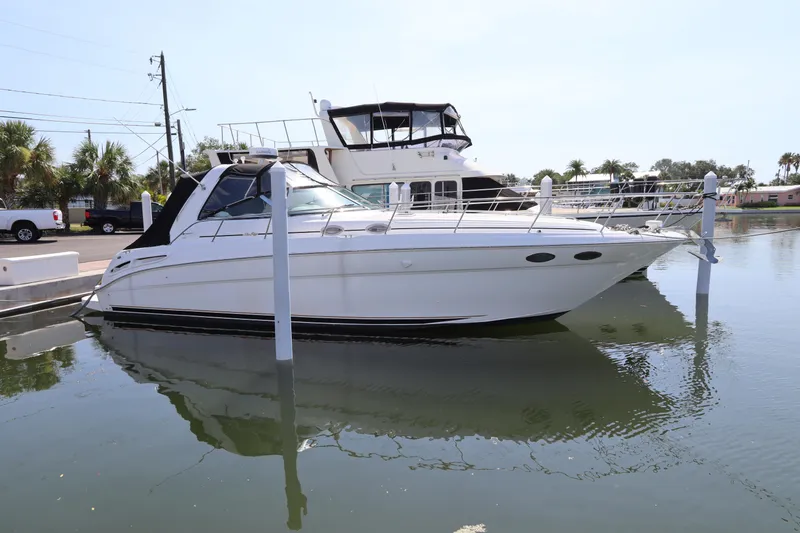 Slide: The Image of 1999 Sea Ray 380 Sundancer yacht docked in a marina. - 2