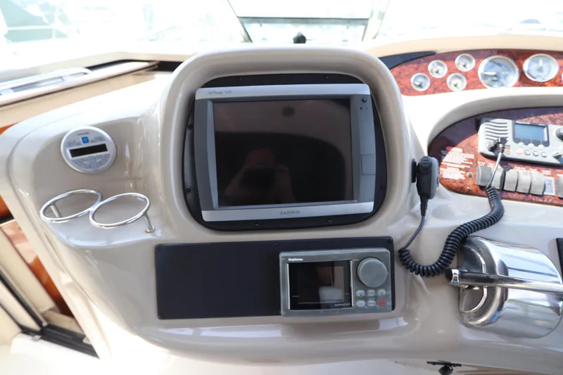 Slide: The Image of Control panel of a 1999 Sea Ray 380 Sundancer boat with navigation equipment. - 20