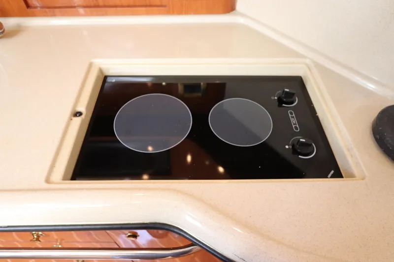 Slide: The Image of Built-in stovetop on 1999 Sea Ray 380 Sundancer yacht kitchen counter. - 29