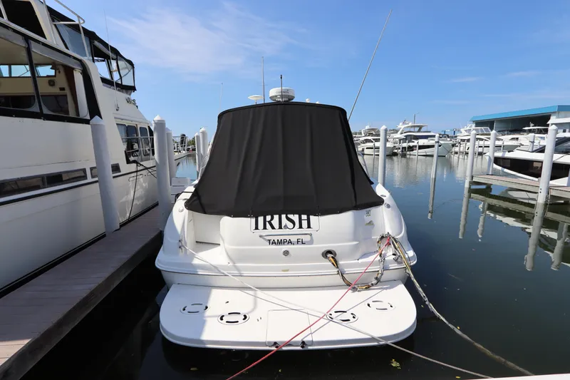Slide: The Image of 1999 Sea Ray 380 Sundancer docked at marina, rear view. - 3