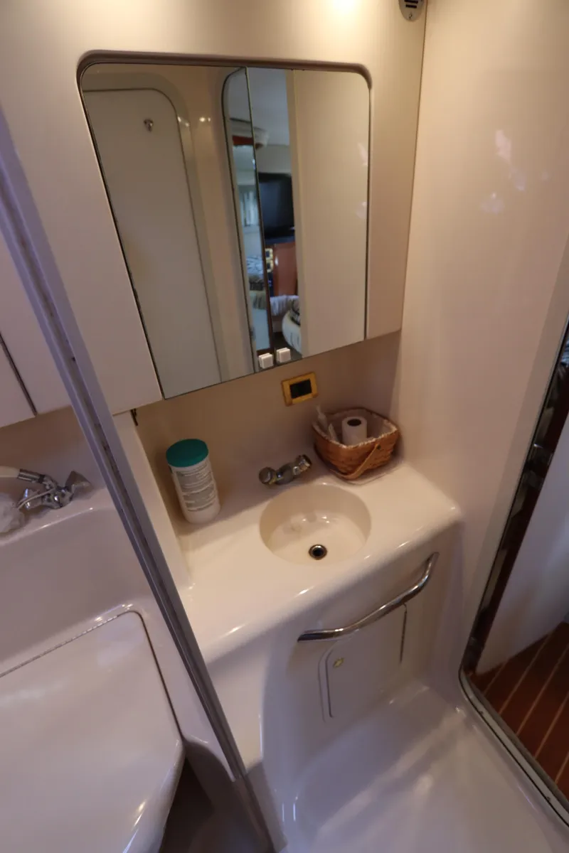 Slide: The Image of Bathroom vanity in 1999 Sea Ray 380 Sundancer yacht with sink and mirror. - 34