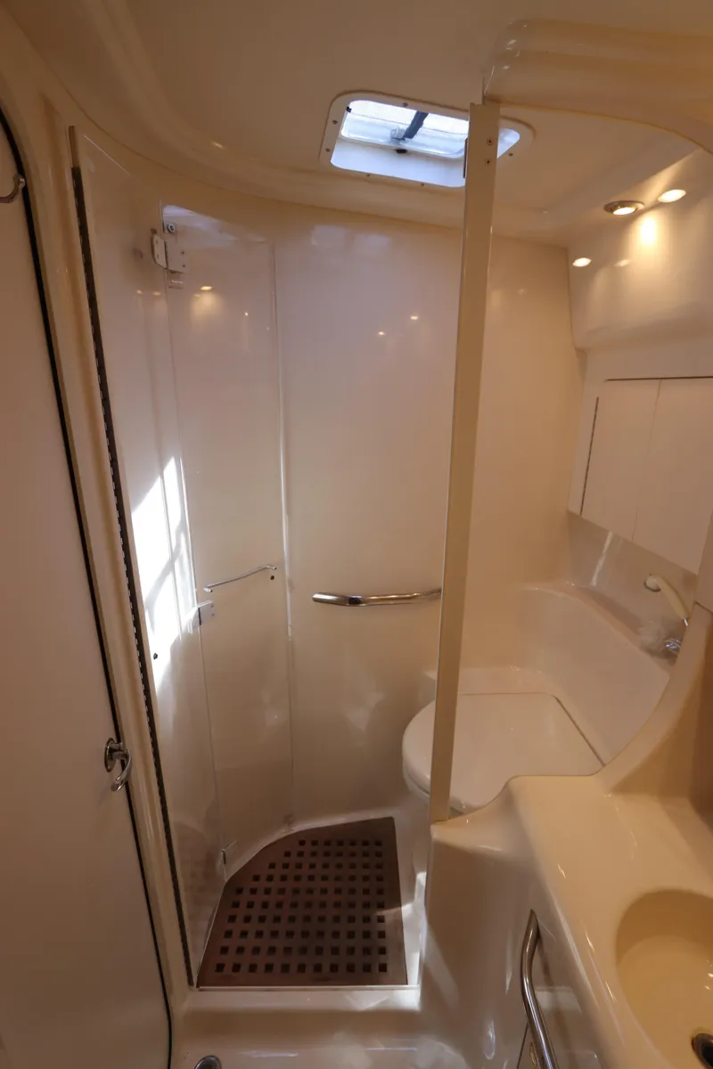 Slide: The Image of 1999 Sea Ray 380 Sundancer bathroom with shower and skylight. - 35
