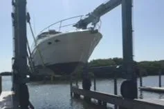 Slide: The Image of 1999 Sea Ray 380 Sundancer being lifted out of the water. - 38