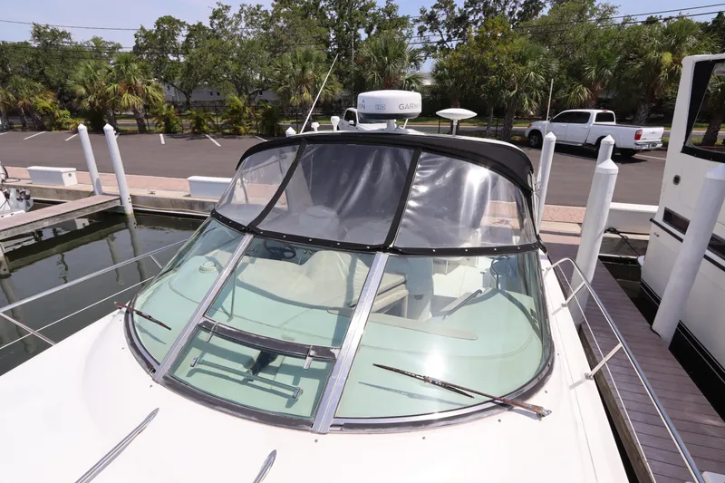 Slide: The Image of 1999 Sea Ray 380 Sundancer docked at a marina. - 6