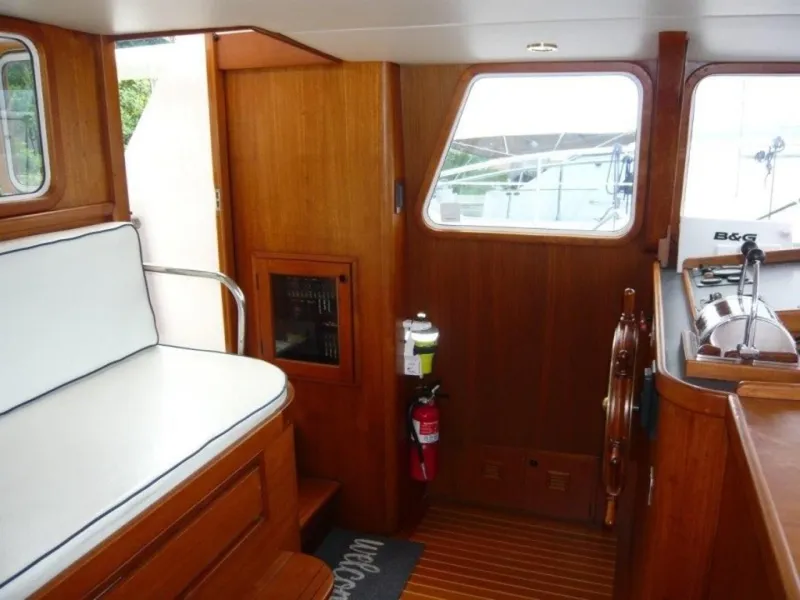 Slide: The Image of Interior of 1990 Cheoy Lee Sloop with wooden finish and nautical decor. - 30