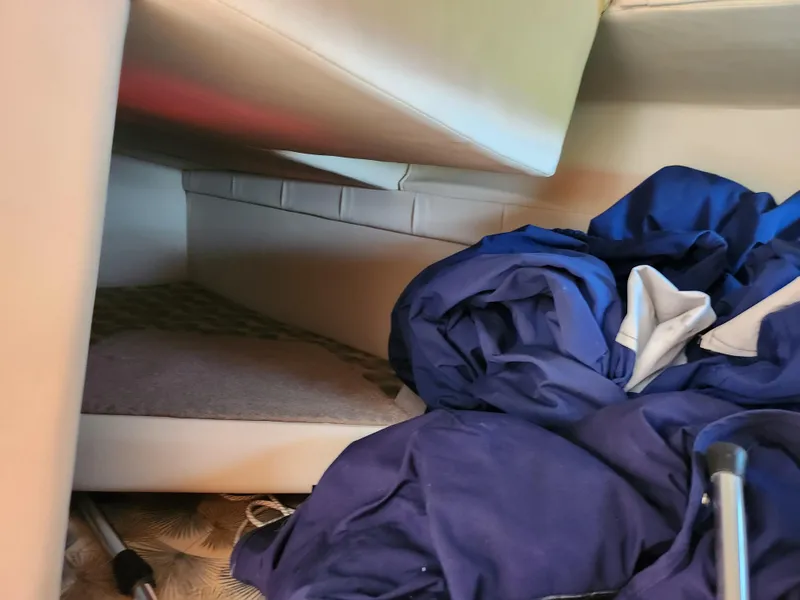 Slide: The Image of Interior cabin of a 2008 Glastron GT 249 boat with blue fabric. - 25