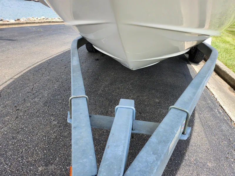 Slide: The Image of 2008 Glastron GT 249 boat on a trailer, close-up view of the hull. - 7