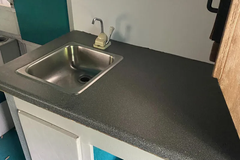 Slide: The Image of 1994 Sun Tracker PARTY HUT 30 OB kitchen sink and countertop. - 10