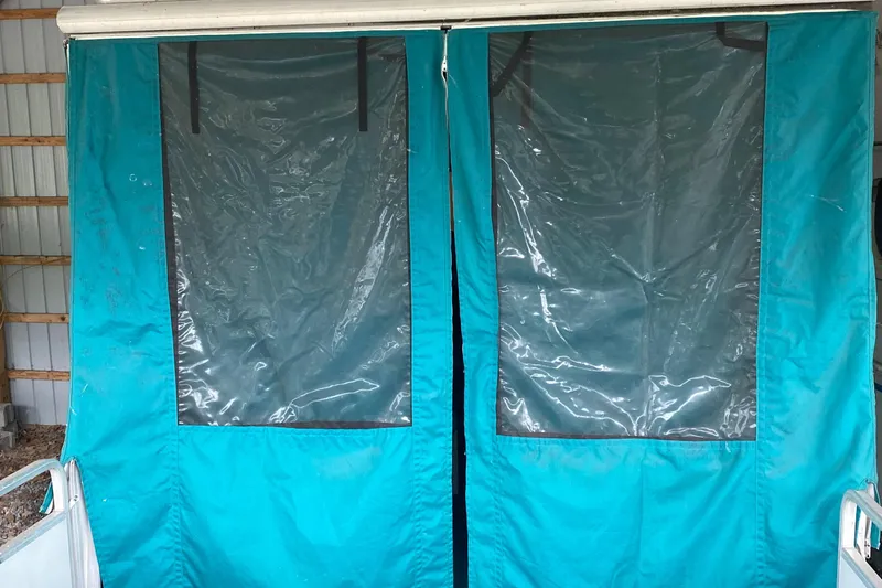 Slide: The Image of 1994 Sun Tracker PARTY HUT 30 OB with teal canvas enclosure. - 5