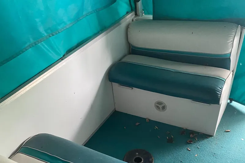 Slide: The Image of Interior seating of a 1994 Sun Tracker PARTY HUT 30 OB boat. - 6