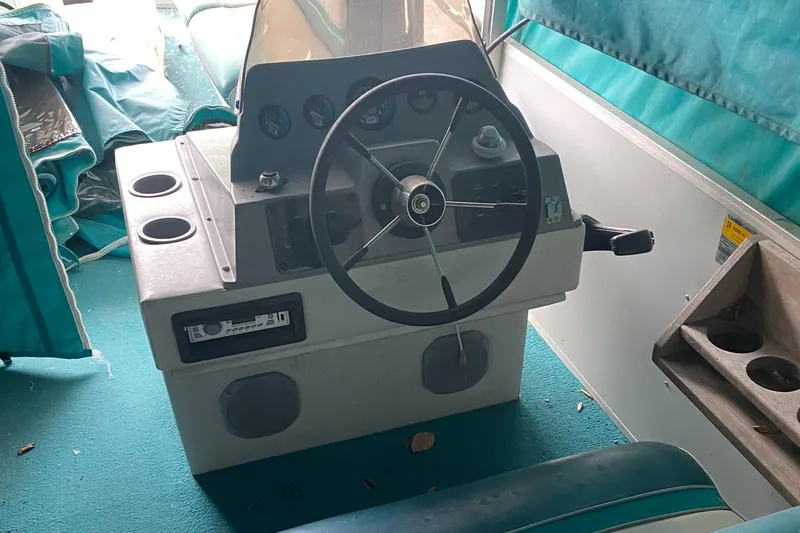 Slide: The Image of 1994 Sun Tracker PARTY HUT 30 OB boat steering console with gauges and controls. - 7