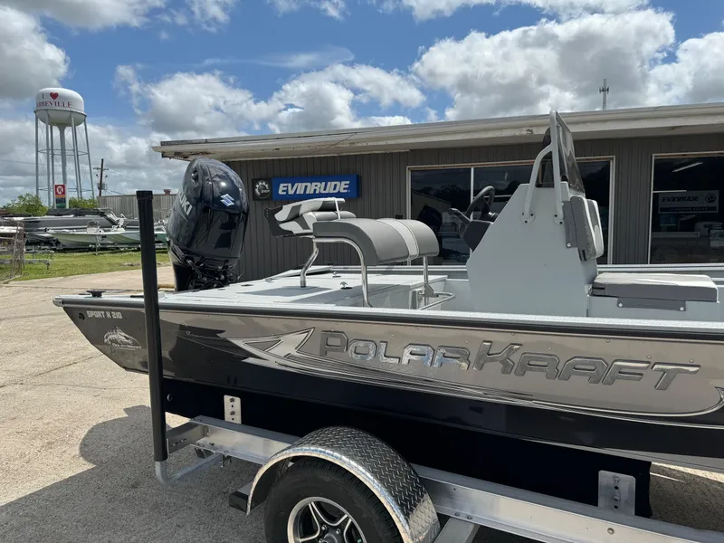 Slide: The Image of 2023 Polar Kraft SPORTX210CC boat on trailer outside dealership. - 3