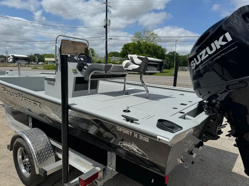 Slide: The Image of 2023 Polar Kraft SPORTX210CC boat with Suzuki outboard motor on trailer. - 7