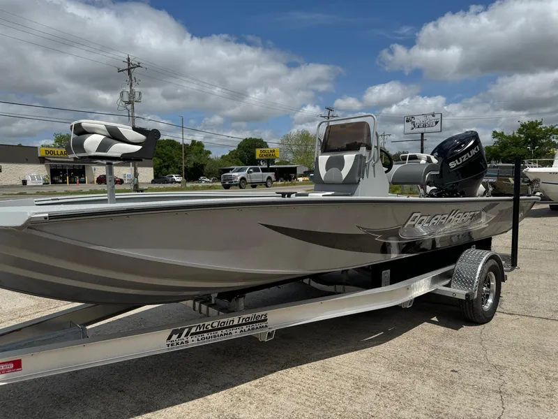 Slide: The Image of 2023 Polar Kraft SPORTX210CC boat on a McClain trailer, parked outdoors. - 8