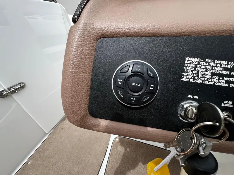 Slide: The Image of Control panel of a 2011 Cobalt 200 boat with ignition keys and warning label. - 12