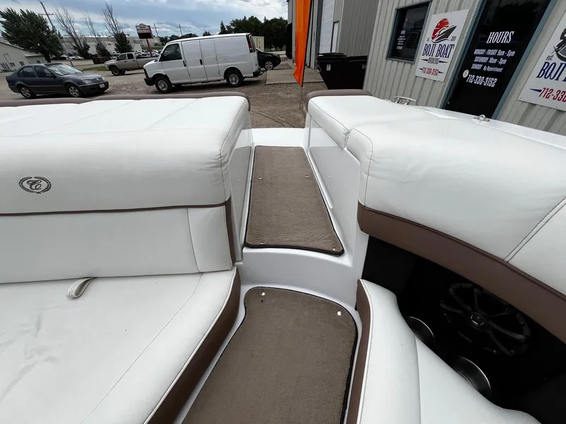 Slide: The Image of Interior of a 2011 Cobalt 200 boat with white and brown seating. - 20