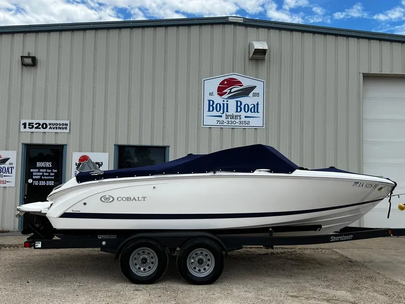 Slide: The Image of 2011 Cobalt 200 boat on trailer outside Boji Boat Brokers building. - 24