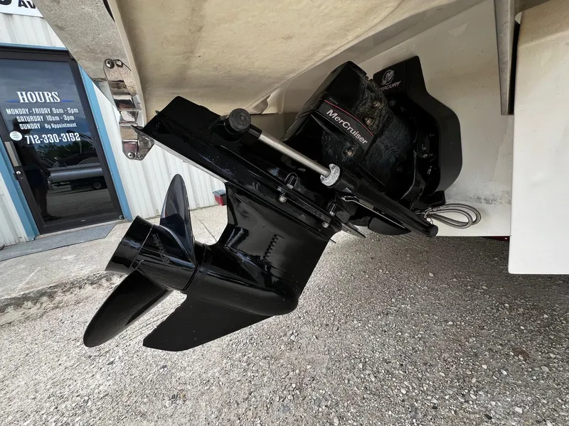 Slide: The Image of Close-up of a 2011 Cobalt 200 boat's MerCruiser outboard motor and propeller. - 8