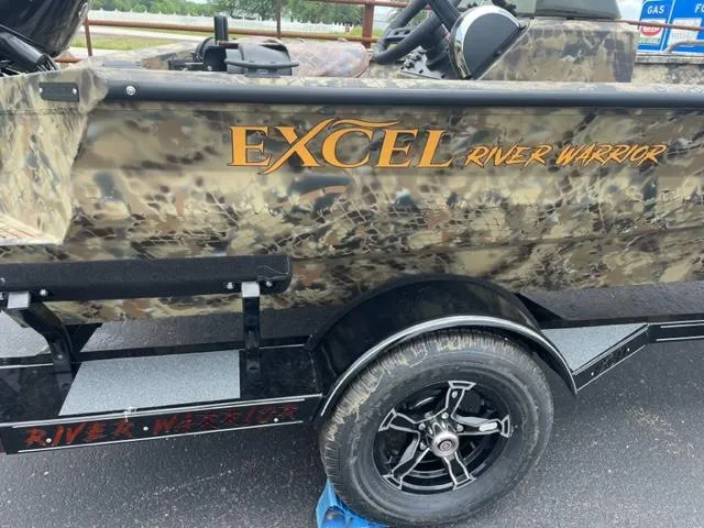 Slide: The Image of 2024 Excel 1751 River Warrior boat with camouflage design and trailer. - 3