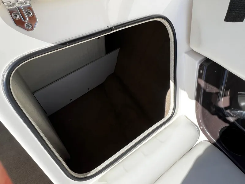 Slide: The Image of Storage compartment in a 2004 Regal 2200 Bowrider boat. - 10