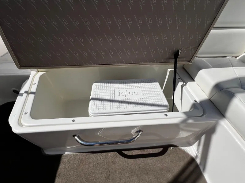 Slide: The Image of Storage compartment with Igloo cooler in 2004 Regal 2200 Bowrider boat. - 21